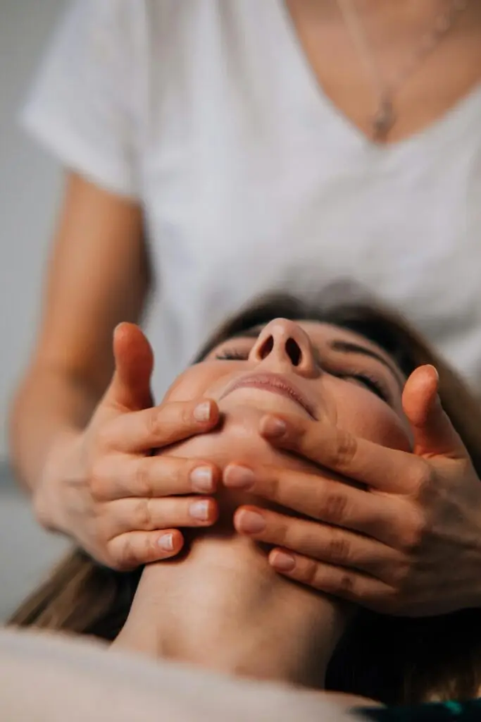 Woman having a relaxing Back, Neck & Face massage