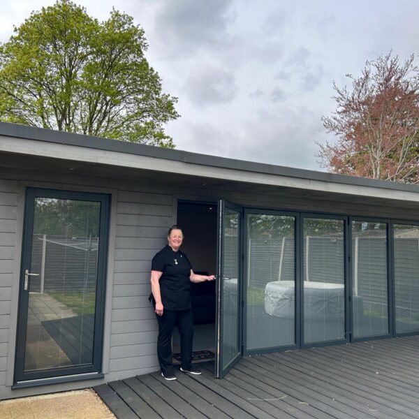 Hazel opening the door into the multi-purpose treatment room
